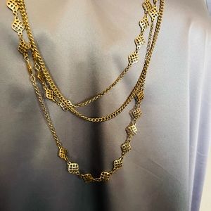 Long multi-chain gold necklace
